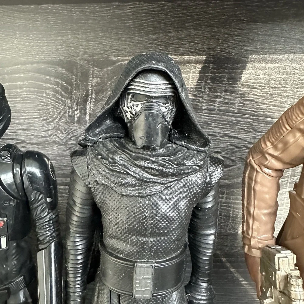 Star Wars action‎ figures Darth Vader, a TIE Fighter Pilot, Kylo Ren, and Finn